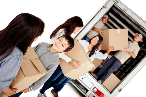 Moving team handling flat removals in Chiswick on a residential street