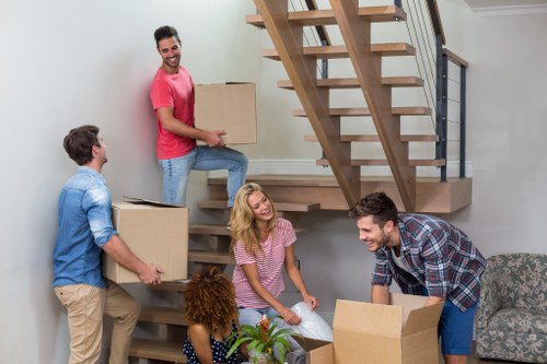 Packed office equipment and furniture ready for relocation in Chiswick