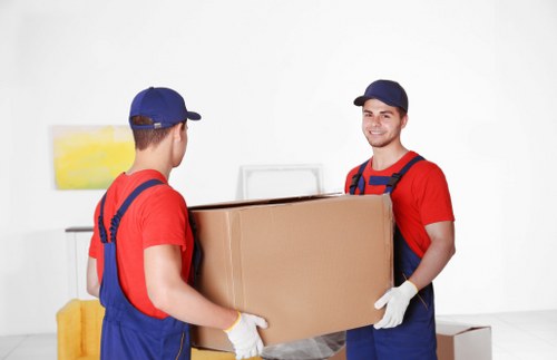 Removal team preparing a residential move in Chiswick with furniture and boxes