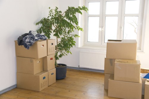 Local moving team handling boxes and household items in West London